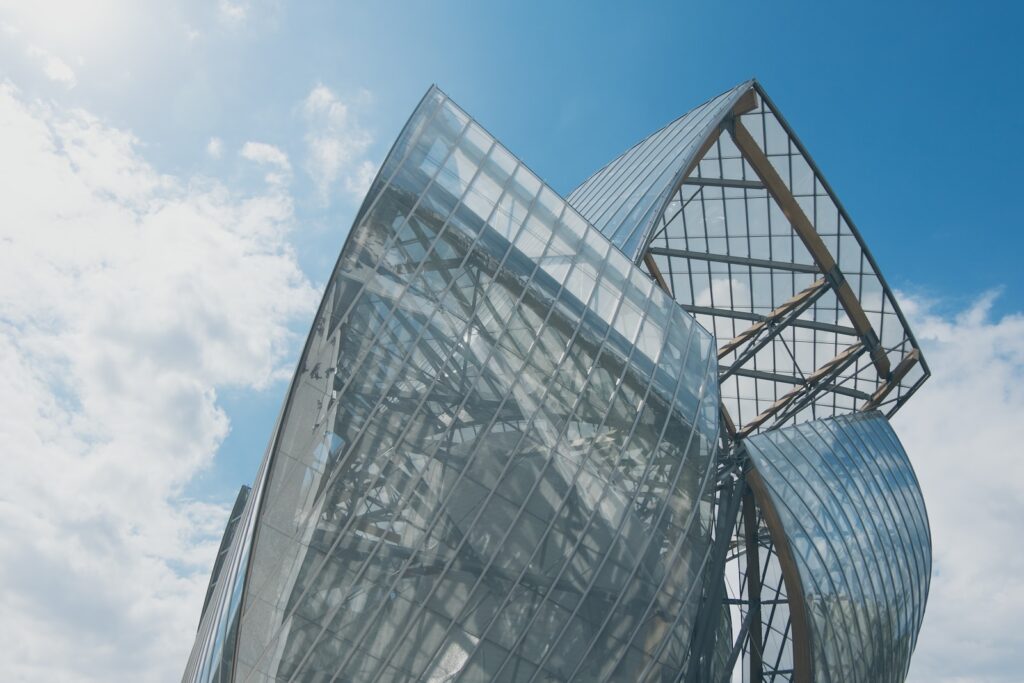 curtain wall building under white and blue sky