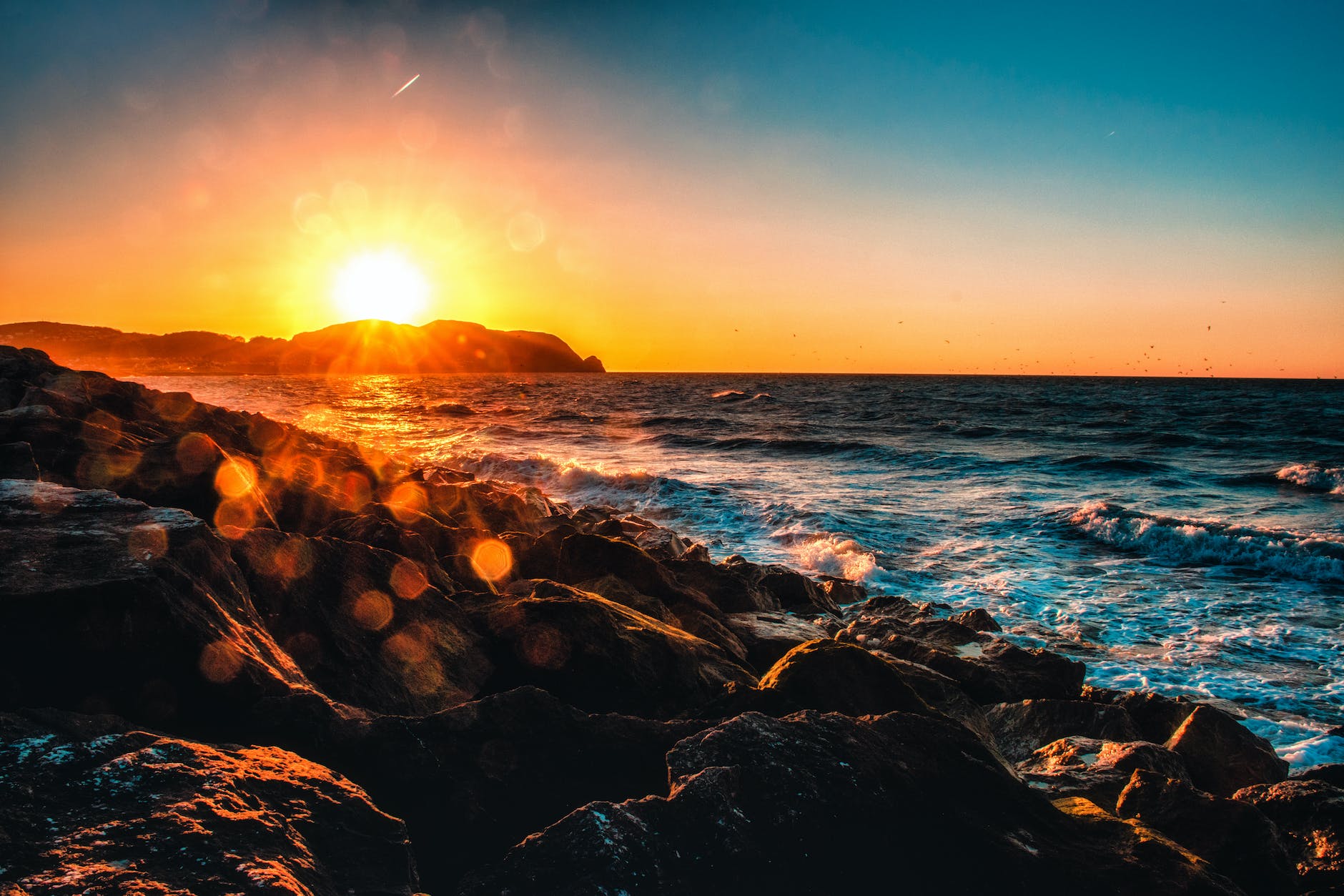 body of water during sunset