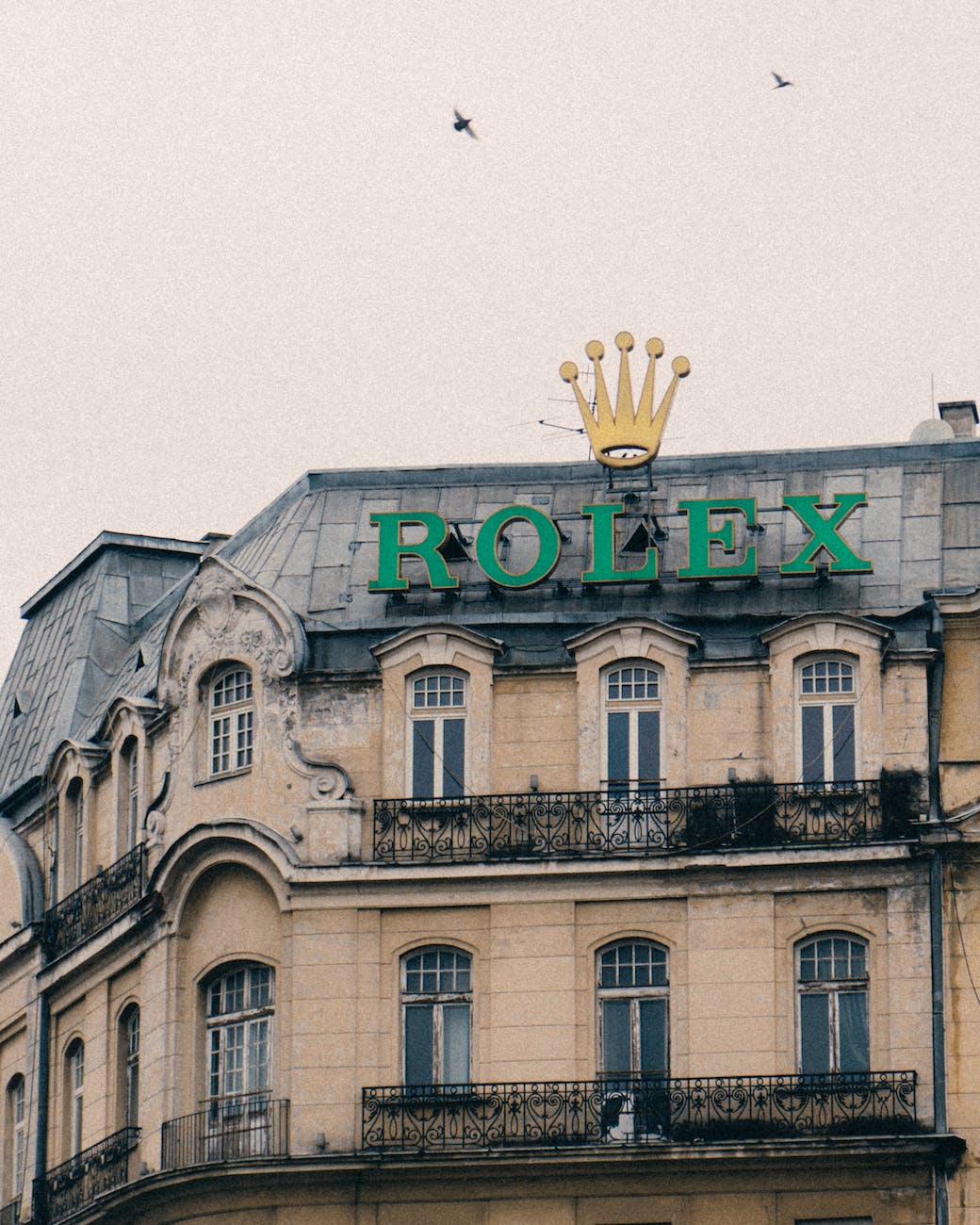 a rolex signage on a building