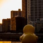 a large inflatable duck floating in a body of water